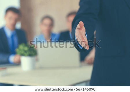 Closeup of a business man giving hand for handshake