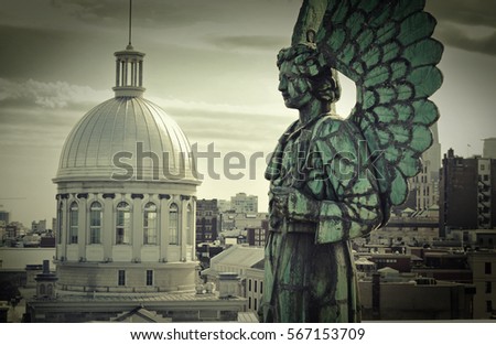 Angel monument and the dome of Bonsecours market in old Montreal, Canada