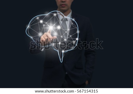 Businessman hand pointing the brain on dark background, technology and healthy concept