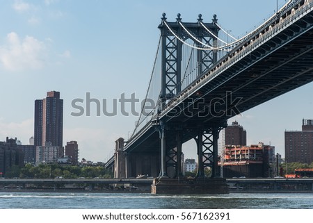 Manhattan bridge with Manhattan skyline view and blue sky