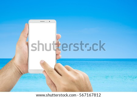 man hands holding mobile phone isolated screens display on the beach background.
