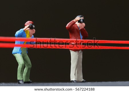 Photographer with red tape