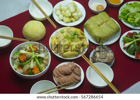 Amazing of Vietnamese food for Tet holiday in spring, it is traditional food on lunar new year: Banh chung, Boiled chicken, pickled onions, spring rolls ...