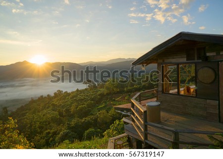 Wooden house on the top of the mountain in thailand Royalty-Free Stock Photo #567319147
