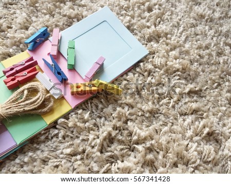 Accessories for making chain of picture frames for decoration on gray carpet