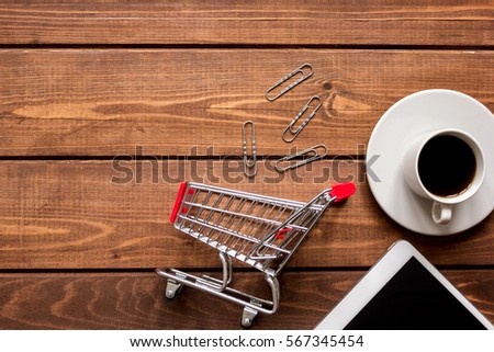 concept online shopping with smartphone on wooden background mock up