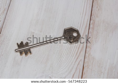 keys on a light wooden table