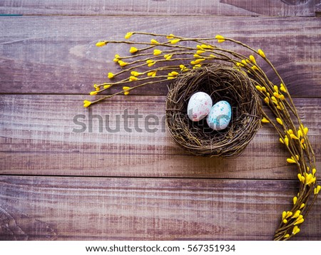 decorative nest for Easter on a wooden background