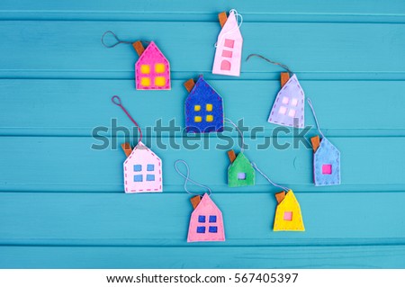 Spring background with colorful houses over blue  wooden background