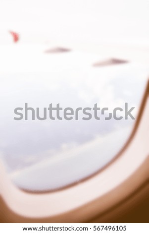 Blurred  background abstract and can be illustration to article of Clouds and sky as seen through window of an aircraft