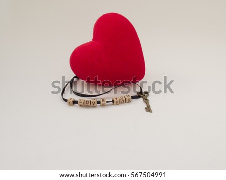 Red heart with key and the word I LOVE YOU on white background
