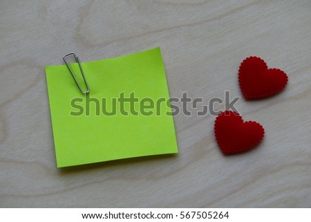 Note paper with heart on wood background, love and valentine concept with copy space for text