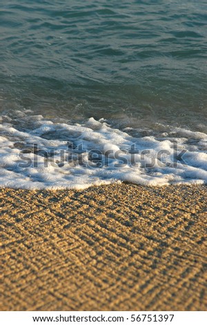 Vacation image of waves on a tropical beach