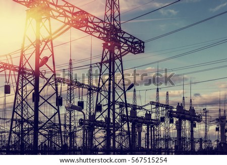  high-voltage  power lines at sunset. electricity distribution station . Royalty-Free Stock Photo #567515254
