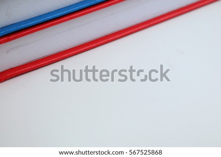 Notebook on white table background