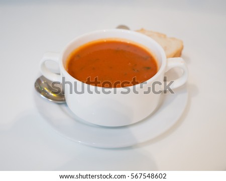tomato soup in the cup Royalty-Free Stock Photo #567548602