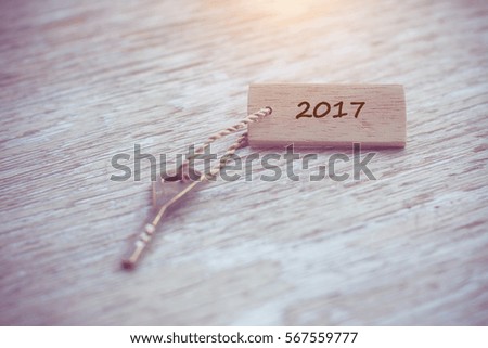 Old key vintage on wood with tag 2017.