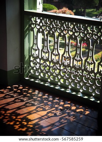 wood crafts terrace decoration with colonial art style pattern on historic architecture under natural lighting show beautiful cutting edges and shadows on the floor