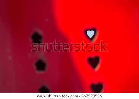 heart symbol on red metallic surface