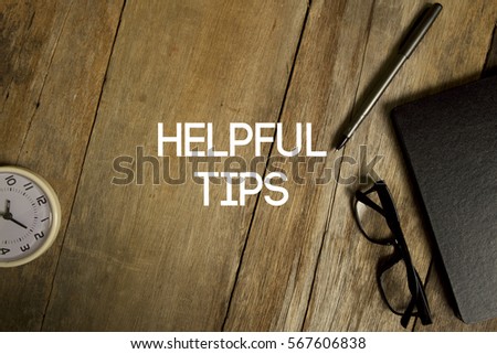 HELPFUL TIPS CONCEPT ON WOODEN BACKGROUND