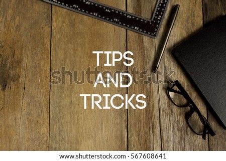 TIPS AND TRICKS CONCEPT ON WOODEN BACKGROUND