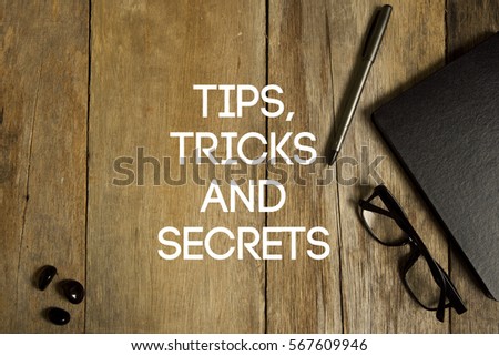 TIPS, TRICKS AND SECRETS CONCEPT ON WOODEN BACKGROUND
