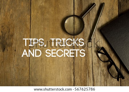 TIPS, TRICKS AND SECRETS CONCEPT ON WOODEN BACKGROUND