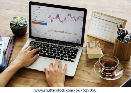 Businessman Working Plan On A Wooden Table