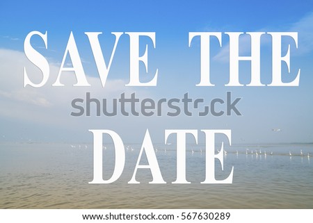 Save the Date word with a blue sky