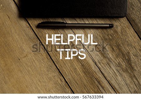 HELPFUL TIPS CONCEPT ON WOODEN BACKGROUND
