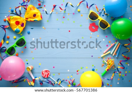 Colorful frame with party items on blue background. Happy birthday concept