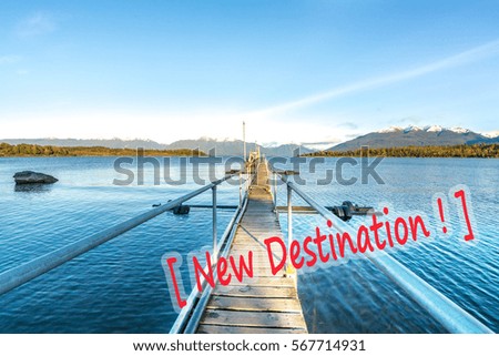 Lake and wooden jetty with natural morning sunlight