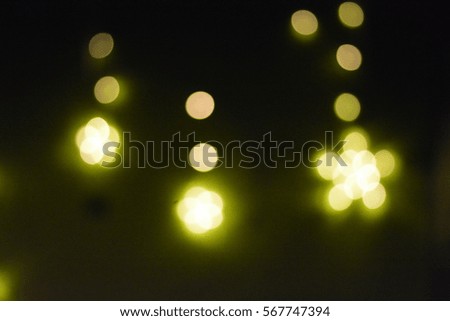 Green star and round shape with its yellow light shine through dark background in the nightclub at night, gold star,yellow star bokeh,wallpaper,star shape,star shining,star at night,dream,dreaming
