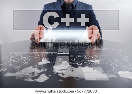 Businessman using tablet pc and selecting c++.