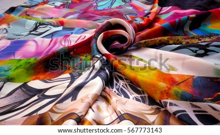 Photo silk fabric. Silk scarf with bright abstract print. Textile Design. Painting fabric, silk painting in batik      