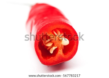 Red hot chilli pepper and slice on white background, raw material for make cooking.the chili in the slit closeup
