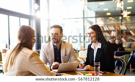 Brainstorming at coffee break out of the office. Royalty-Free Stock Photo #567812128