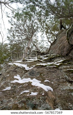Snow clings to a rocky cliff in the Upper Peninsula of Michigan.