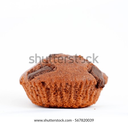 picture of a fresh baked chocolate muffin on white background