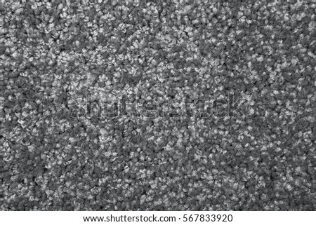 Macro shot of a carpeting texture background. Gray Textile floor covering. Grey Knotted-pile carpet