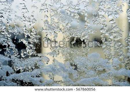 frozen glass on the window in winter