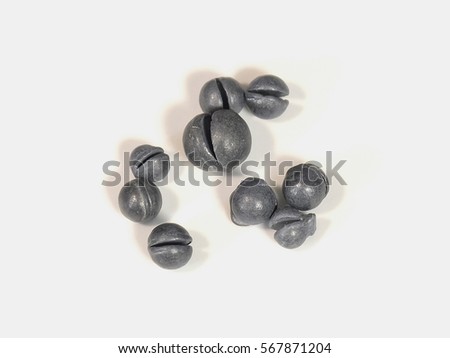 The fishing sinkers of different weight isolated Royalty-Free Stock Photo #567871204