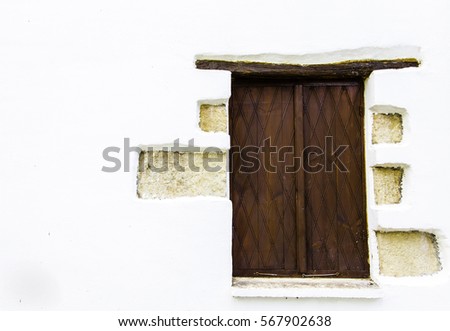 brown wooden window on the white wall