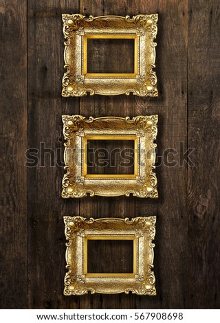 Group of Old Gold Picture Frames on wooden wall