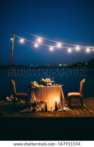 Beautiful decoration for wedding dinner at night  Royalty-Free Stock Photo #567911554