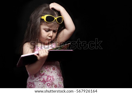 A girl who is confused while reading a book