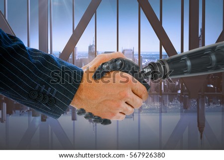 Cropped hands of robot and businessman dealing against room with large window looking on city