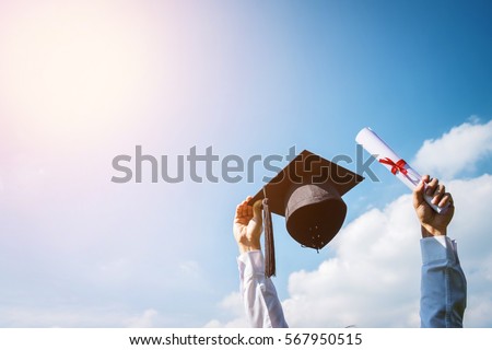 Graduation day, Images of graduates are celebrating graduation put hand up, a certificate and a hat in hand, Happiness feeling, Commencement day, Congratulation  Royalty-Free Stock Photo #567950515