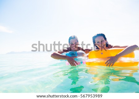 Young Couple With Pool Raft