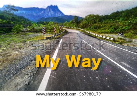 Inspirational and motivational quote with phrase My Way blurry road & mountain background.